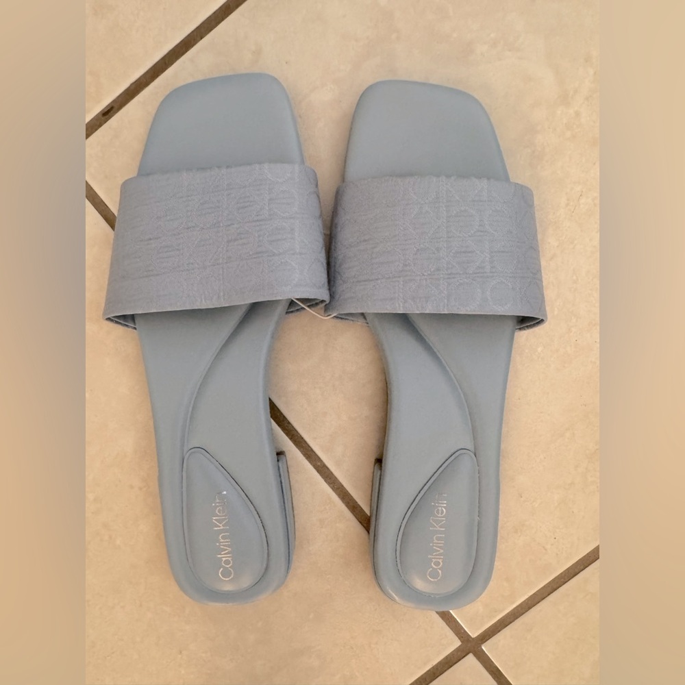 Blue Calvin Klein flat sandals